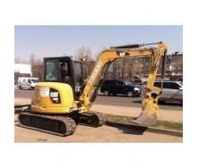 Выкорчевывание пней мини-экскаватором Caterpillar 305